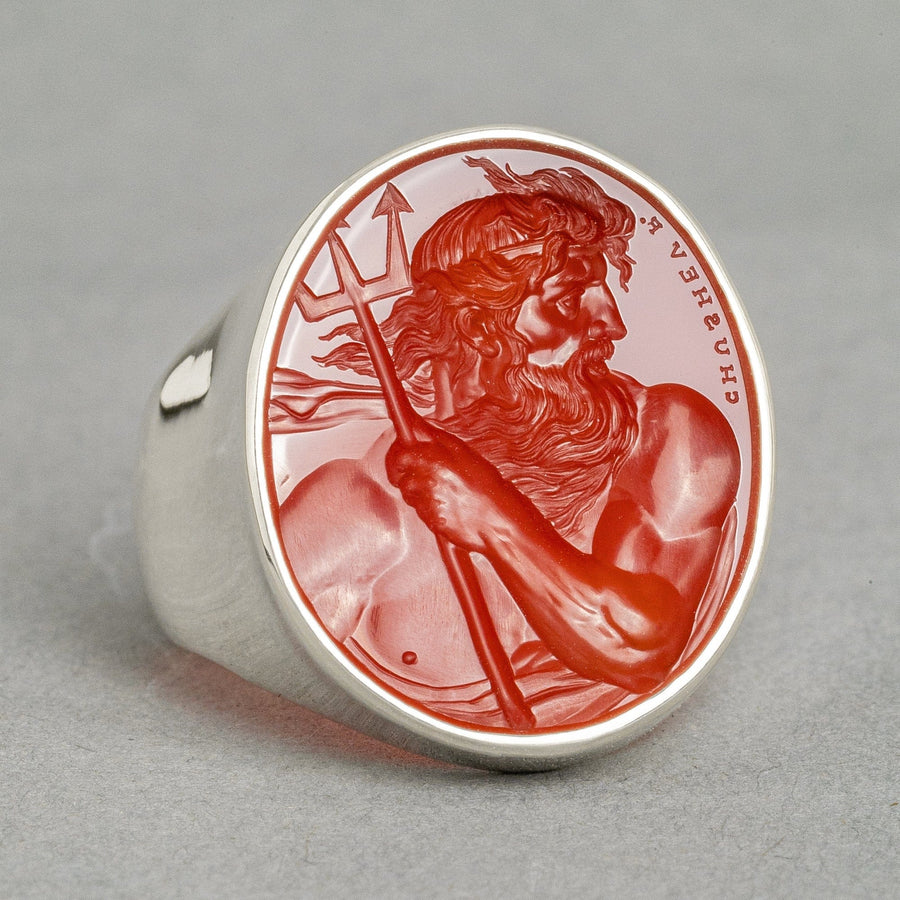 close up posedion carnelian intaglio on silver ring